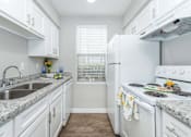 Thumbnail 1 of 35 - Kitchenat Royal Wildewood Manor Apartments, Clute, Texas