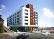 Thumbnail 4 of 22 - a rendering of an apartment building with cars parked in front of it