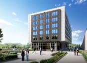 Thumbnail 6 of 22 - A modern building with a glass facade and people walking in front.