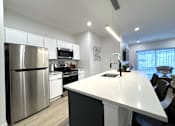 Thumbnail 3 of 22 - View of typical kitchen with stainless steel appliances and breakfast bar overlooking the great room