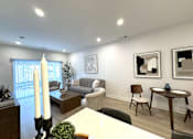 Thumbnail 4 of 22 - View of great room towards dining & living area and sliding glass doors to private patio