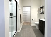 Thumbnail 8 of 22 - View of typical en-suite bathroom leading to walk-in closet from primary bedroom