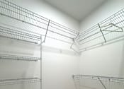 Thumbnail 10 of 22 - Typical walk-in closet with shelving