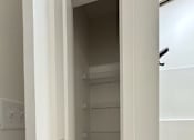 Thumbnail 12 of 22 - View inside typical linen closet