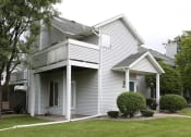 Thumbnail 14 of 20 - View of exterior showing wooden balcony and private, covered front entrance