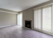 Thumbnail 15 of 20 - View of great room living area with fireplace and faux wood flooring