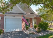 Thumbnail 16 of 27 - Exterior view of ranch end unit private entrance & attached 1-car garage