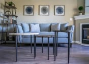 Thumbnail 4 of 27 - View of living area of great room showing corner fireplace & plank flooring
