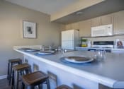 Thumbnail 5 of 27 - Kitchen area of great room with breakfast bar & bar stools
