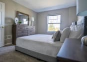 Thumbnail 6 of 27 - Interior view of carpeted bedroom with entrance to bathroom
