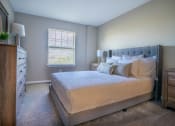 Thumbnail 7 of 27 - Interior view of carpeted bedroom from entrance to hallway