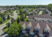 Thumbnail 24 of 27 - Exterior aerial view of Webster Woods townhomes neighborhood looking east