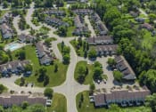 Thumbnail 26 of 27 - Exterior aerial view of Webster Woods townhomes neighborhood looking east towards 5-Mile Line Road