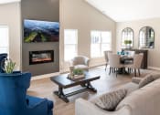 Thumbnail 1 of 22 - Interior of Champion Reserve Townhomes 2-bedroom end unit Great Room with fireplace.