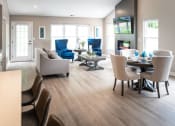Thumbnail 6 of 22 - Interior of Champion Reserve Townhomes 2-bedroom end unit Great Room view of living, dining & part of kitchen area