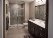 Thumbnail 13 of 22 - Interior view of Champion Reserve Townhomes primary bathroom with step-in shower.