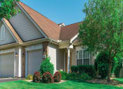 Thumbnail 25 of 31 - a house with a lawn and trees in front of it