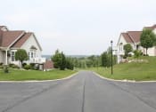 Thumbnail 29 of 31 - a street with houses on the side of a road