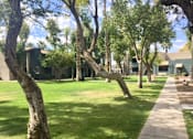 Thumbnail 6 of 8 - a sidewalk and trees in front of a building