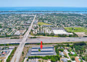 Thumbnail 13 of 29 - an aerial view of a city with an arrow pointing to the ocean