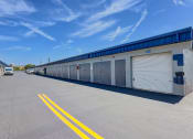 Thumbnail 3 of 29 - the garage doors are closed on the side of a building