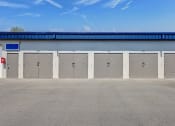 Thumbnail 4 of 29 - a row of locked doors on the side of a building