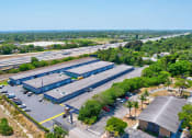 Thumbnail 7 of 29 - an aerial view of a factory with an empty parking lot