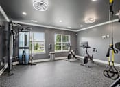 Thumbnail 38 of 60 - A spacious home gym with a variety of exercise equipment at Venue at 109 Apartments, Lebanon , TN, 37090
