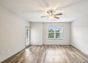 Thumbnail 6 of 60 - A room with a ceiling fan and a window with a view of a green landscape at Venue at 109 Apartments, Lebanon 