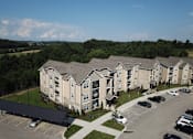 Thumbnail 56 of 60 - an aerial view of a large apartment complex with a parking lot and trees in the background at Venue at 109 Apartments, Lebanon , TN, 37090
