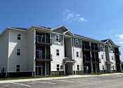 Thumbnail 10 of 10 - Apartment building with the number 1700 on the front.