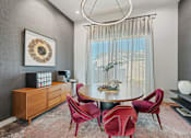 Thumbnail 15 of 44 - Dining room with round table at Edge and Stone, San Antonio, TX
