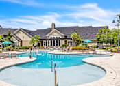 Thumbnail 38 of 39 - A large swimming pool in front of a house.