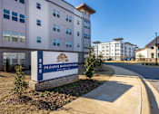 Thumbnail 38 of 38 - A sign for Prosper Madison Oaks is in front of a building.