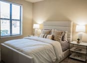 Thumbnail 15 of 30 - a bedroom with a large bed and a window