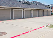 Thumbnail 4 of 30 - a row of garage doors on the side of a building