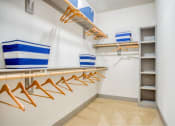 Thumbnail 2 of 19 - a walk in closet with a rack of hangers at The Mark, Texas, 78230