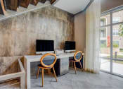 Thumbnail 19 of 19 - a home office with two computers on a desk with two chairs at The Mark, San Antonio, 78230