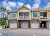 Thumbnail 5 of 14 - the front of a house with two garage doors at Sterling Creek, Richmond Hill, GA 31324