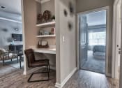 Thumbnail 12 of 14 - a home office with a desk and a door to a bedroom at Sterling Creek, Richmond Hill Georgia