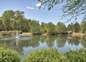Thumbnail 3 of 10 - a fountain in the middle of a lake at Mill Creek Run, Macon, GA 31216