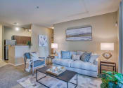 Thumbnail 11 of 20 - a living room with a couch and a table at Spring Creek Apartments, Crestview Florida