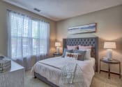 Thumbnail 16 of 20 - a bedroom with a bed and two windows at Spring Creek Apartments, Crestview