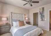 Thumbnail 18 of 20 - a bedroom with a bed and a ceiling fan at Spring Creek Apartments, Crestview, FL