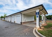 Thumbnail 12 of 74 - A car wash station with a blue sign above it at Waterleaf at Neely Ferry Apartments, South Carolina 29680