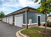 Thumbnail 13 of 74 - A row of garages at Waterleaf at Neely Ferry Apartments, Simpsonville, South Carolina