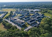 Thumbnail 14 of 74 - A bird's eye view of a large residential complex surrounded by trees at Waterleaf at Neely Ferry Apartments, Simpsonville