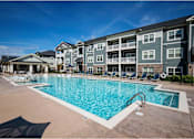 Thumbnail 17 of 74 - A large swimming pool at Waterleaf at Neely Ferry Apartments, Simpsonville, SC 29680