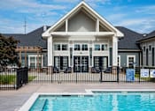 Thumbnail 19 of 74 - A swimming pool in front of a house at Waterleaf at Neely Ferry Apartments, South Carolina