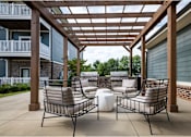 Thumbnail 23 of 74 - Two chairs and a table at Waterleaf at Neely Ferry Apartments, South Carolina
